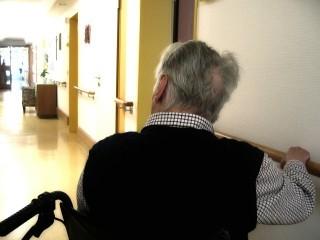 man in wheelchair in the hospital