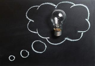 light bulb with talk bubble around it