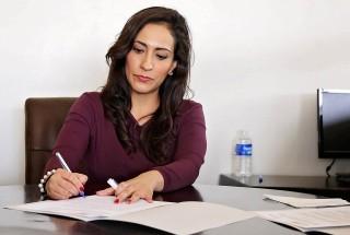 Woman at a desk writing
