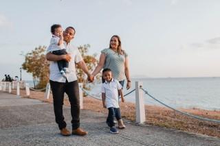 a family walking on a boardwalk