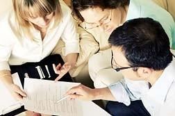 Group of people reviewing a document
