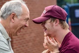 An older man with a child with special needs