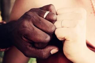 Two hands with wedding rings
