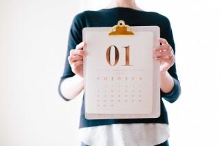 someone holding a calendar to camera