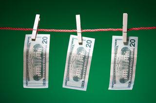 $20 hanging on a clothesline