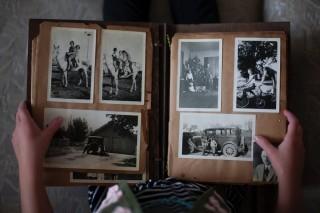 open scrapbook with person reaading it