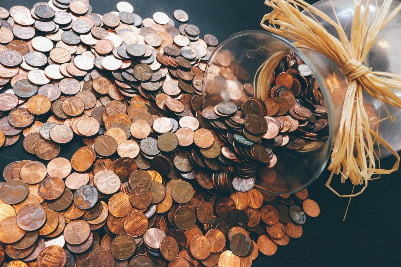 A jar of pennies dumped