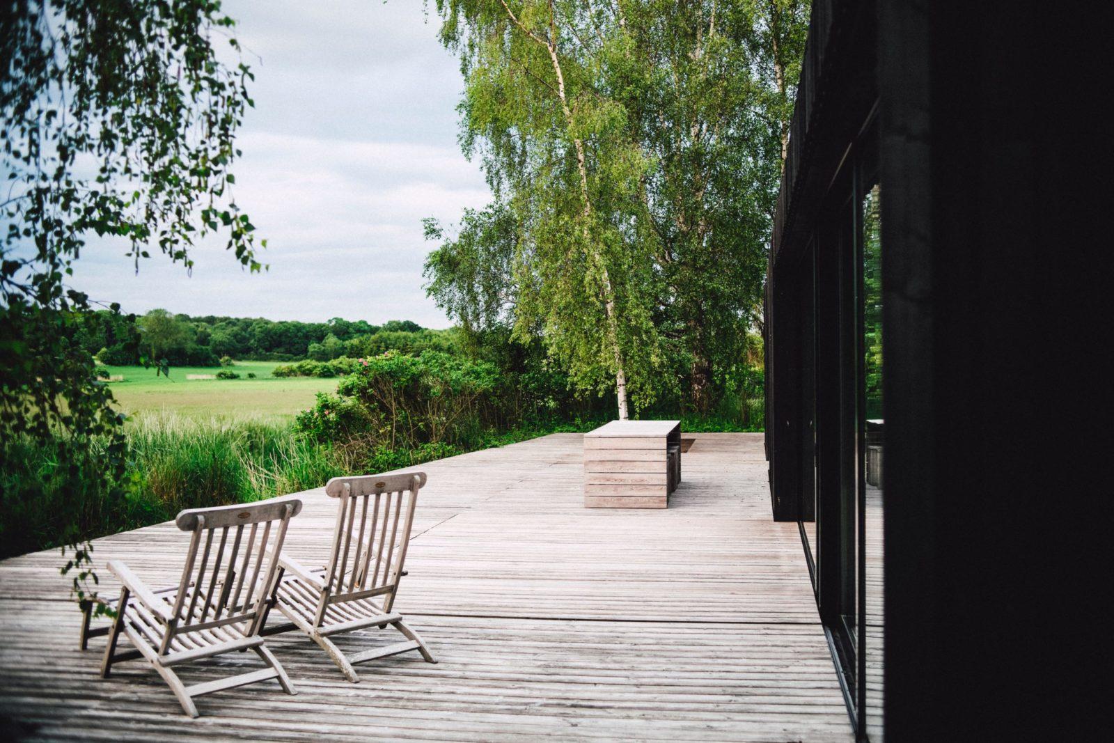 porch with two chairs overlooking a field