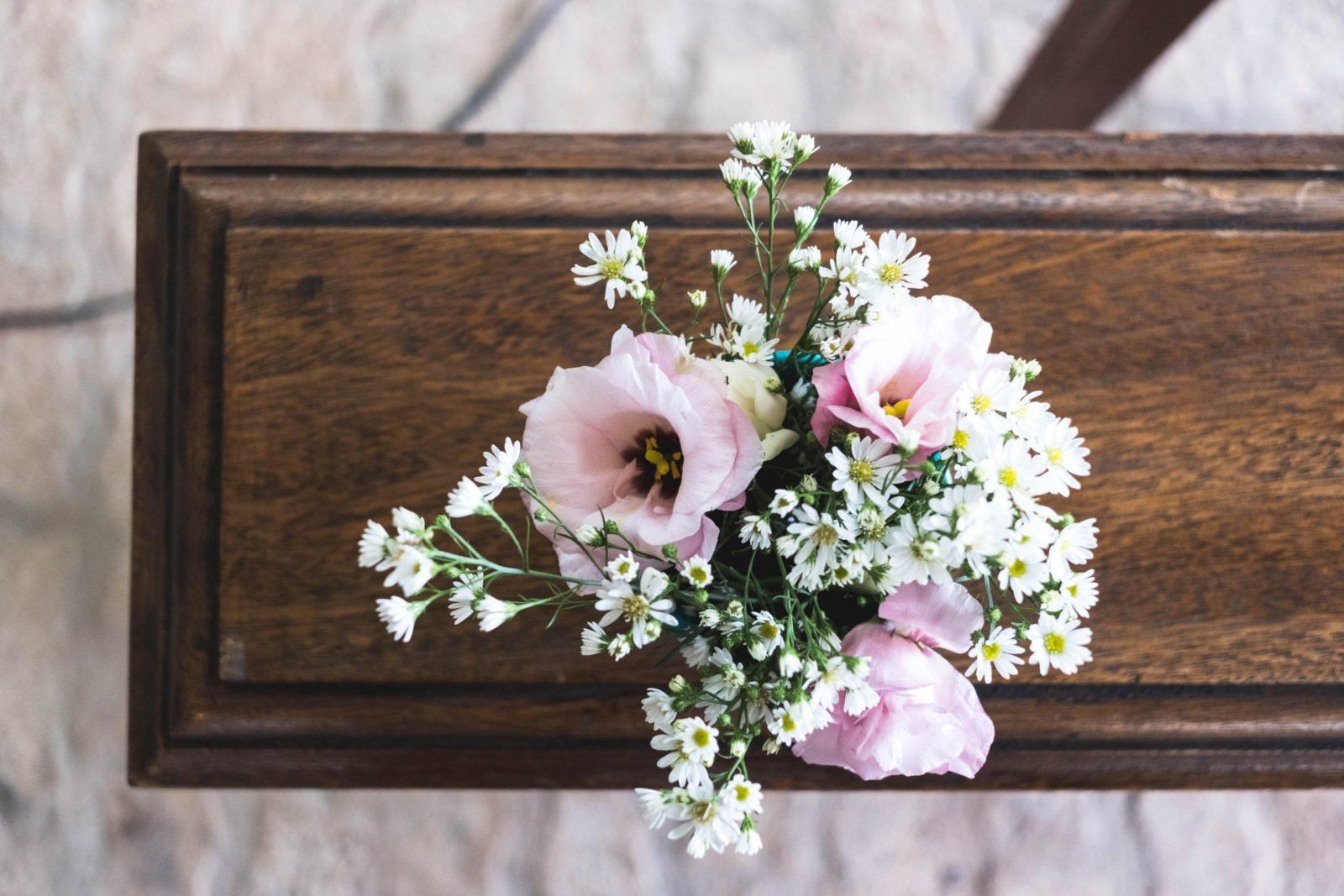 a casket with flowers on top