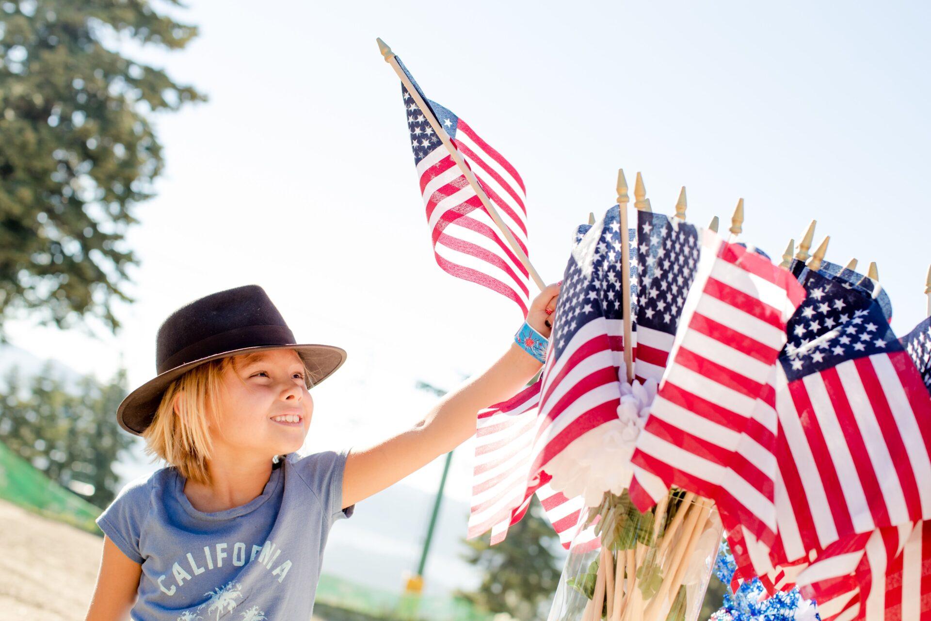 little kid with American flag