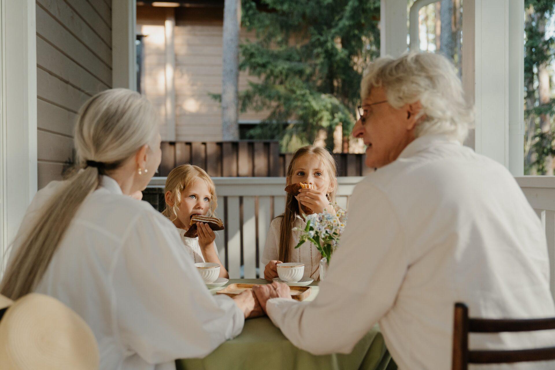 grandparents eating with grandchildren