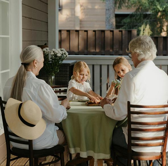grandkids outside on porch with grandparents