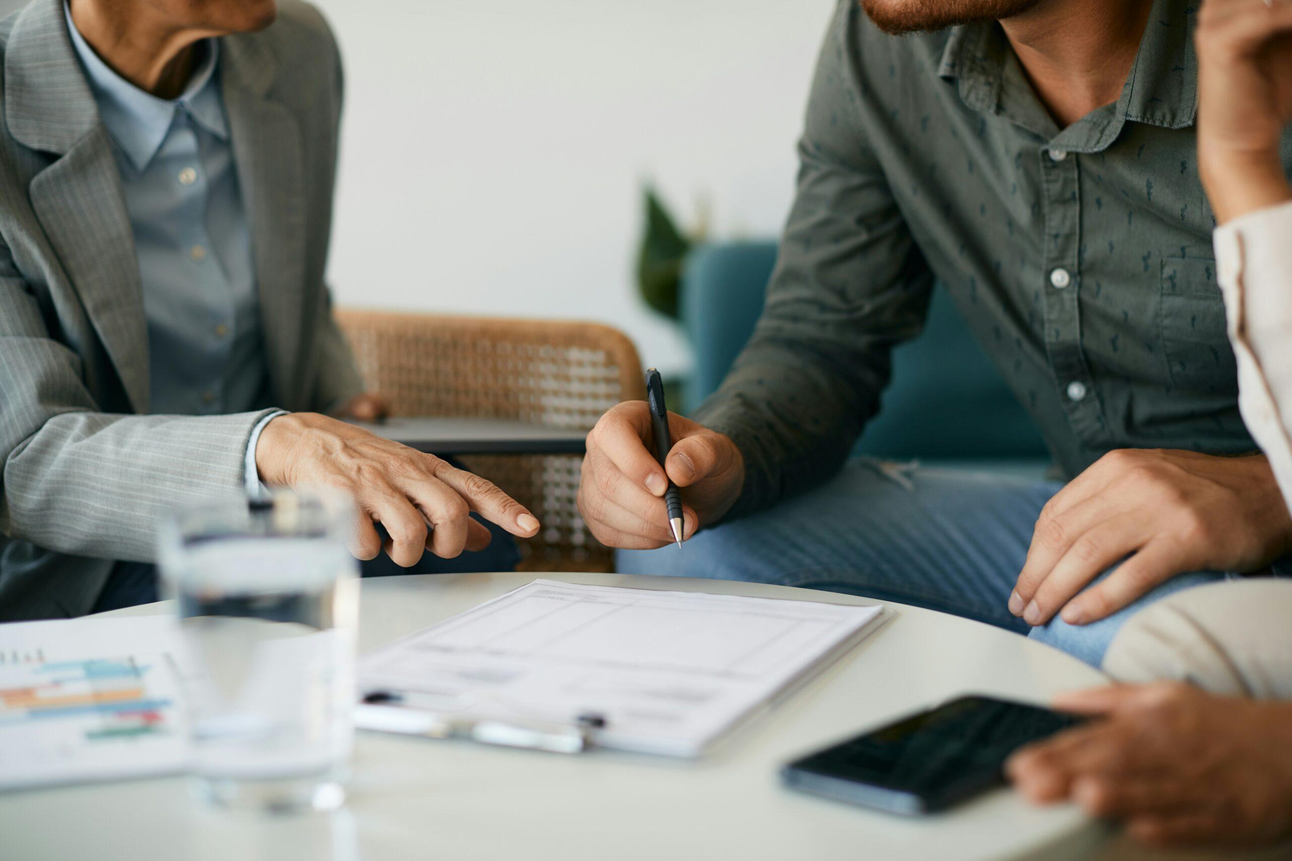 A man preparing to sign a document